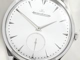 a silver watch with a white face on a silver bracelet