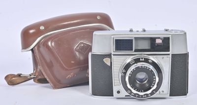 a brown bag and a brown camera next to each other