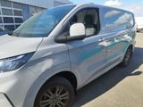 a silver van parked in front of a building