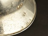 a metal pan with some food in it on a table