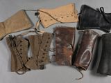 six pairs of leather boots and a pair of leather gloves