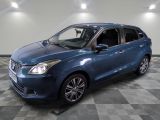 a picture of a blue car that is parked in a garage