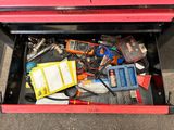 a red tool box with many tools in it