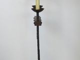 a lamp that is on a stand with a lamp shade on it