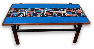a blue table with a red and black design on it