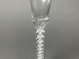 a glass that has a spiral design on it