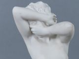 statue of a woman holding her head in her hands
