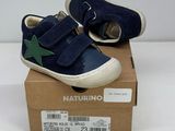 baby boy ' s blue and green star sneakers in a box