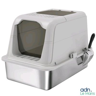 a white cat that is sitting in a litter box