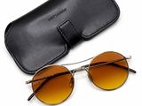 a pair of sunglasses and a case on a white background