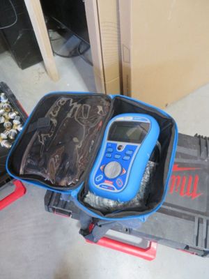 a suitcase with a cell phone inside of it