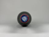 a close up of a black ball with a red and blue logo on it