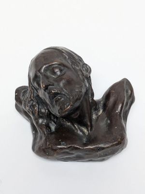 statue of a woman holding her head in her hands