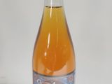 a bottle of soda that is sitting on a table