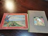 two books sitting on a table with pictures on them