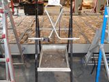 a picture of a room with ladders and a table