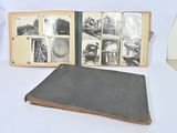 an old book opened to show pictures of people and animals