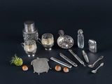 a lot of silver objects on a black surface