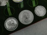 a lot of coins that are in a box