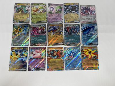 a bunch of pokemon cards sitting on top of a table