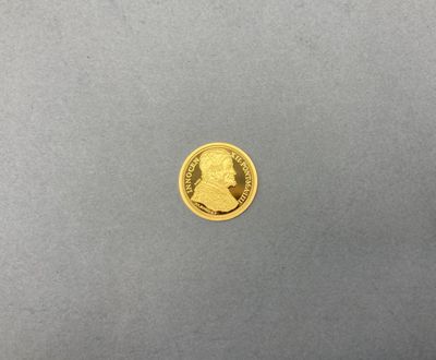 une pièce d'or portant le portrait d'un homme