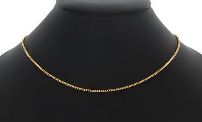 un collier à chaîne en or sur un mannequin mannequin mannequin mannequin mannequin mannequin mannequin mannequin mannequin mannequin