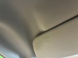 a close up of a car ' s dashboard with the sunroof