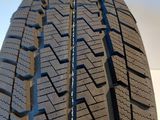 a close up of a tire on a white surface