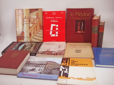 several books on a white table with a white background
