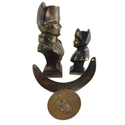 two bronze statues of a man and a woman on a crescent