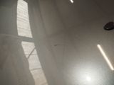 a shadow of a pair of shoes on the floor