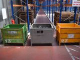 a conveyor belt in the middle of a large warehouse