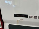 a close up of a white truck with a sticker on it
