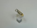 a close up of a diamond ring sitting on top of a white surface