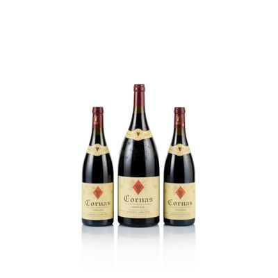 three bottles of wine sit side by side on a white surface