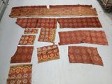 many pieces of cloth laid out on the floor