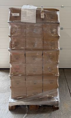 a large stack of boxes on a pallet in a warehouse