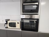 two microwaves and a toaster oven in this kitchen
