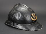 a black helmet with a gold emblem on it