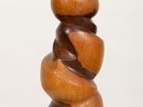 a wooden sculpture that is stacked on top of each other