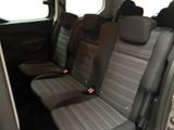 four seats in the back of a van that are empty