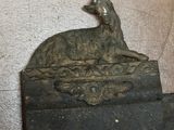 a statue of a dog sitting on top of a box