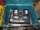 two batteries in a blue box on a table