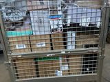 a metal cart with many boxes on top of it