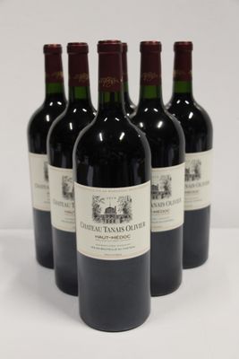 six bottles of red wine are lined up on a white surface