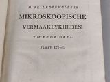 an open book with a black and white title on it