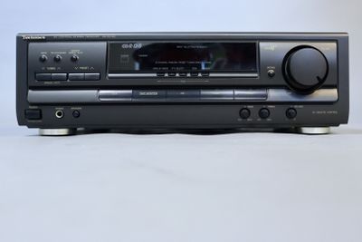 sony cd player with remote control on a white surface