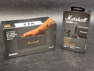 two boxes of marshall ' s bluetooth speaker sitting next to each other on a table