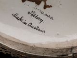 a white plate with writing on it that says it ' s a man