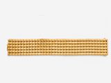 a close up of a gold bracelet on a mannequin mannequin mannequin mannequin mannequin mannequin mannequin manne